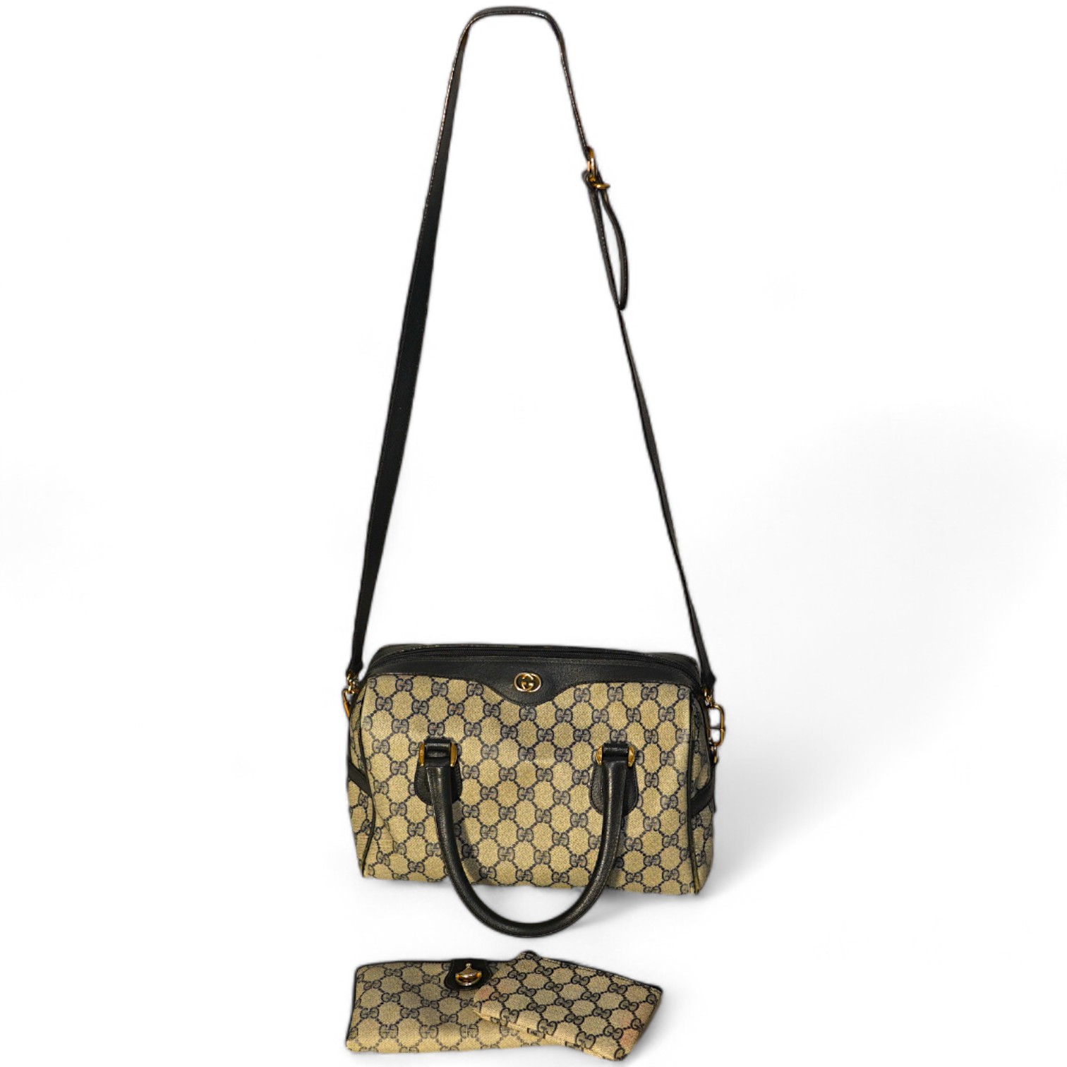 A Gucci monogram blue canvas handbag, wallet and purse